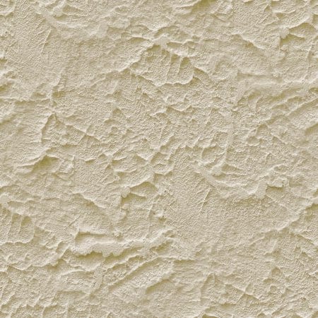 Close-up of smooth beige stucco finish with natural texture variations